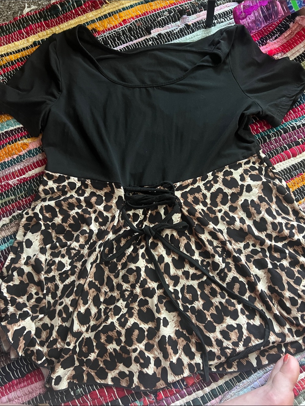 Black Top with Leopard Print Peplum and Lace-Up Waist